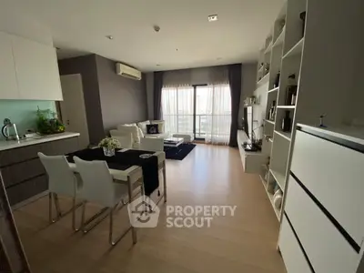 Modern living room with open kitchen and elegant decor