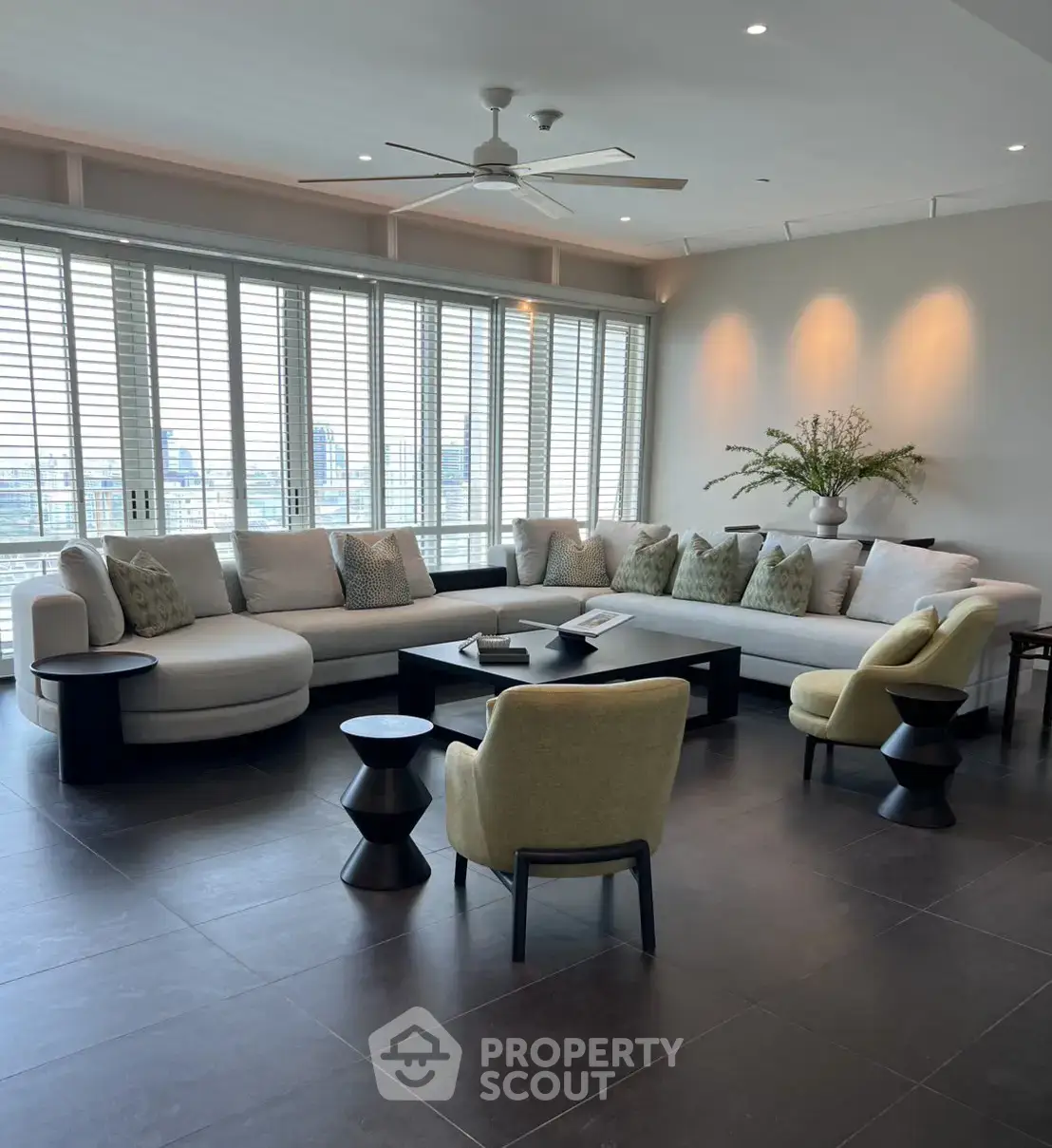 Spacious modern living room with large windows and stylish furniture