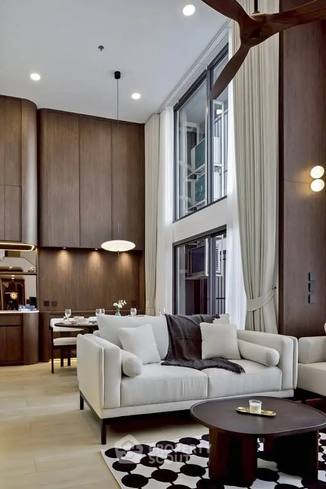 Luxurious modern living room with high ceilings and elegant decor