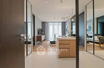 Modern open-plan living room with stylish decor and ample natural light.