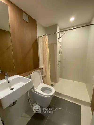 Modern bathroom with sleek shower and elegant fixtures