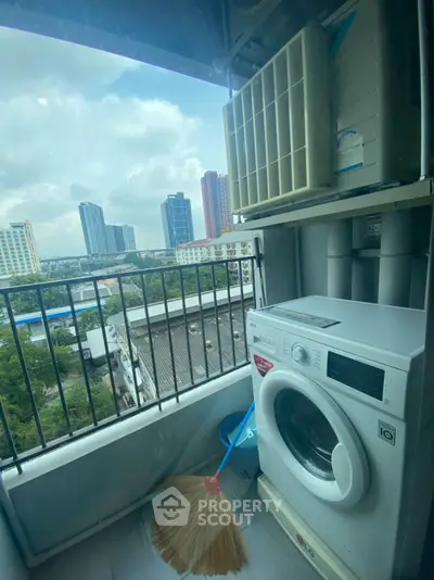 Urban balcony with washing machine and city skyline view