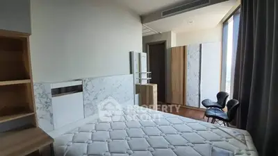 Modern bedroom with marble accents and large window view