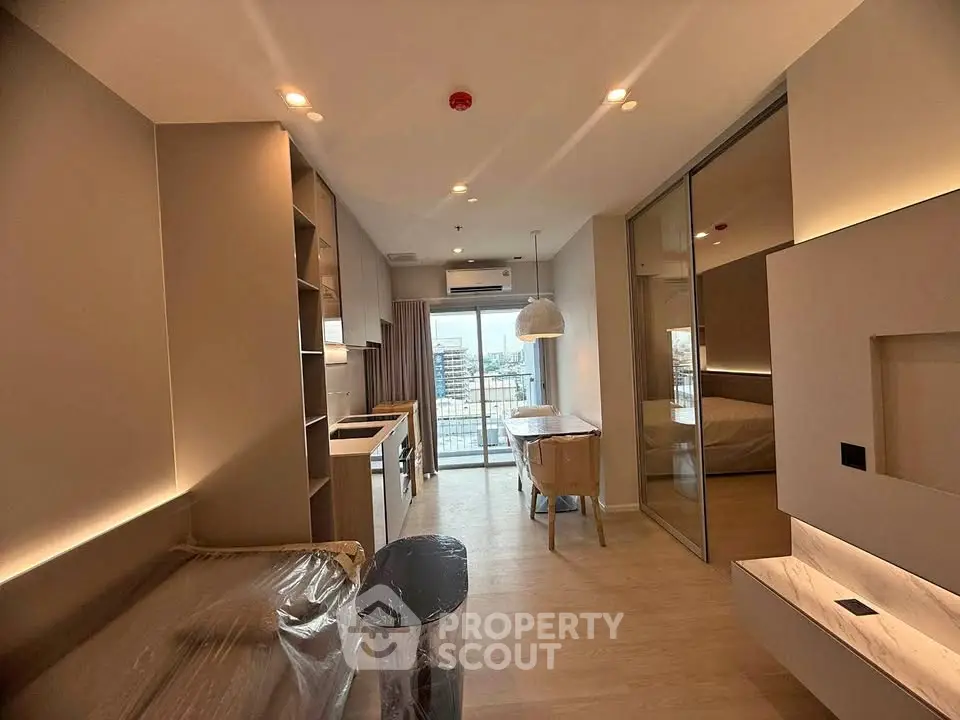 Modern apartment interior with open layout and city view balcony