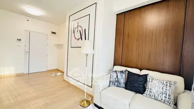 Modern living room with stylish decor and cozy sofa in bright apartment