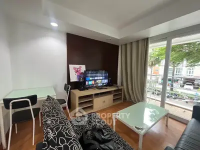 Modern living room with stylish furniture and balcony view