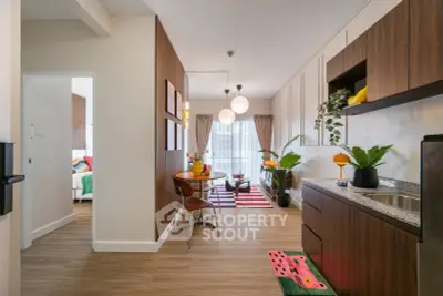 Stylish open-plan kitchen and dining area with modern decor and natural light