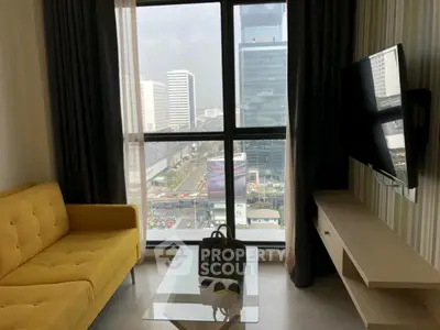 Modern living room with city view, yellow sofa, and wall-mounted TV.