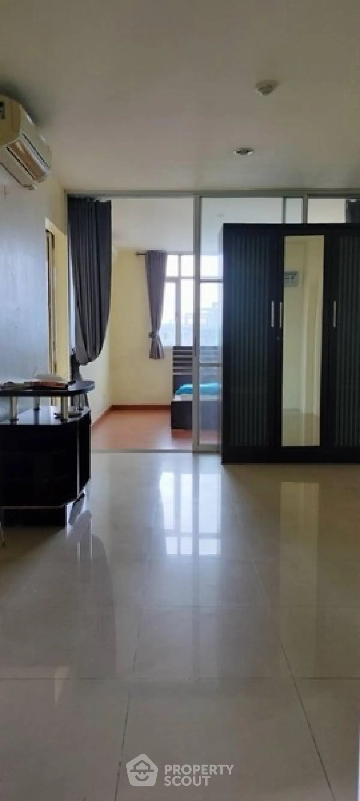 Spacious apartment with open layout and large windows for natural light.