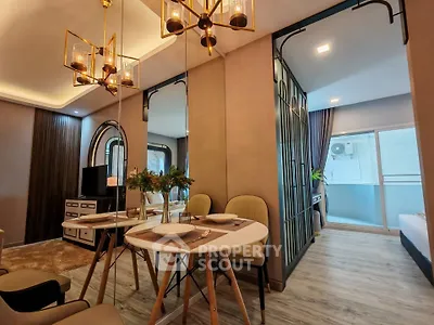 Modern living room with elegant dining area and mirrored walls
