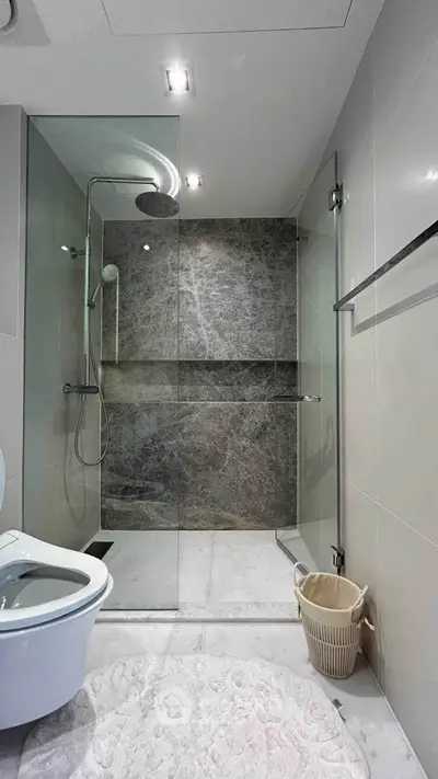 Modern bathroom with glass shower and sleek design