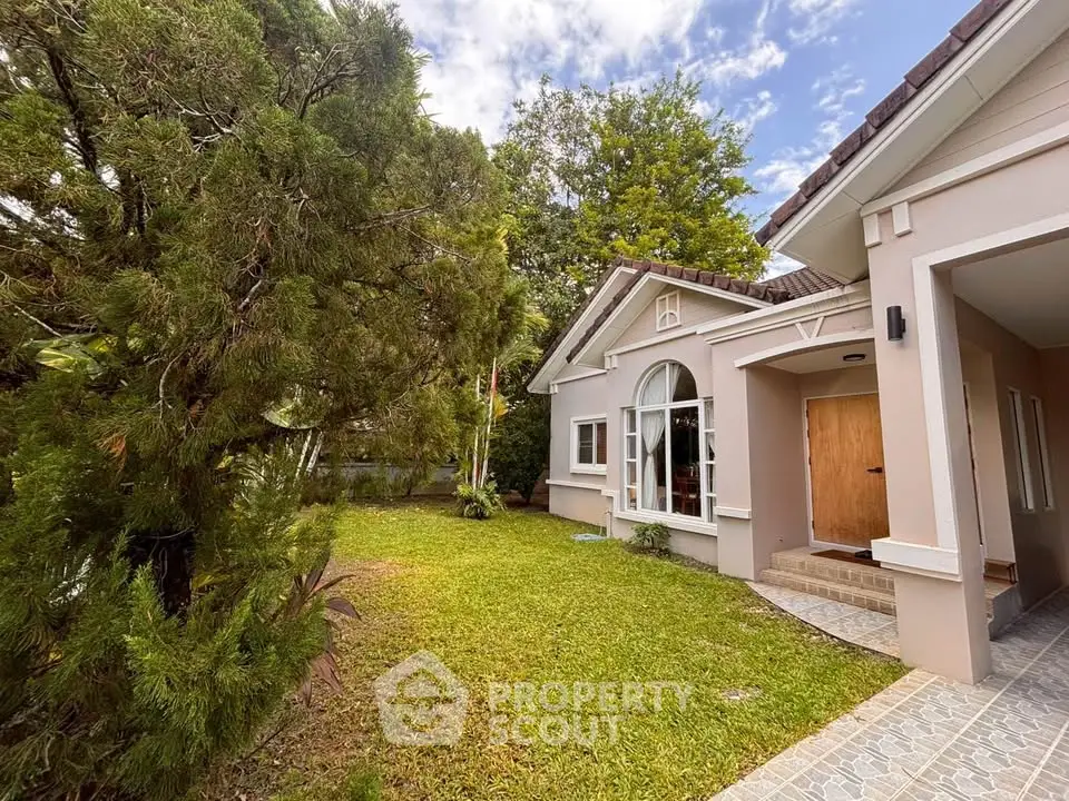 Charming suburban house with lush garden and elegant entrance