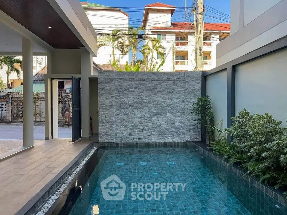 Luxurious private pool area with modern design and lush greenery