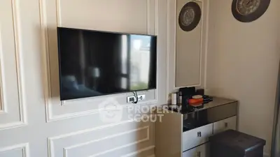 Modern living room with wall-mounted TV and stylish decor