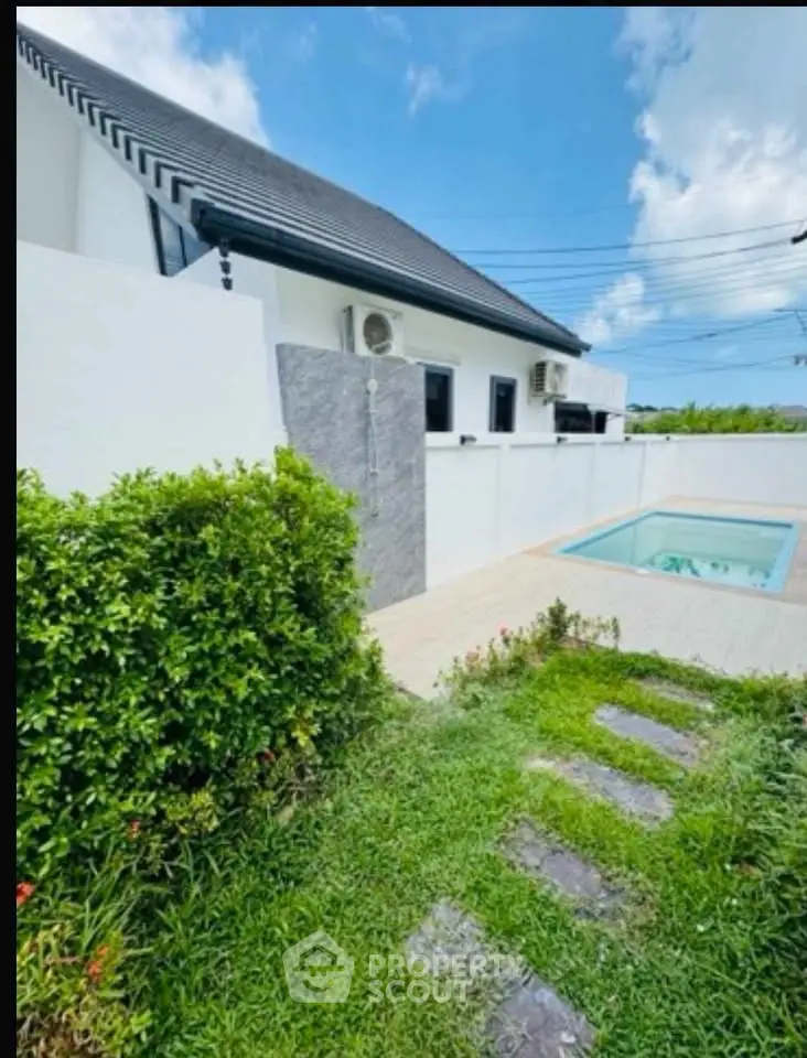Charming modern house with private pool and lush garden, perfect for serene living.