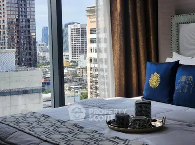 Luxurious bedroom with city view and elegant decor in high-rise apartment