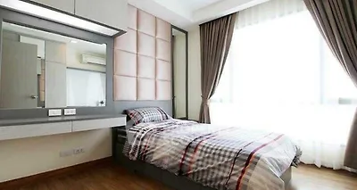 Modern bedroom with stylish decor and large window for natural light