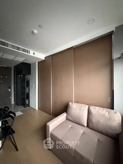 Modern living room with sleek design and cozy sofa in contemporary apartment.
