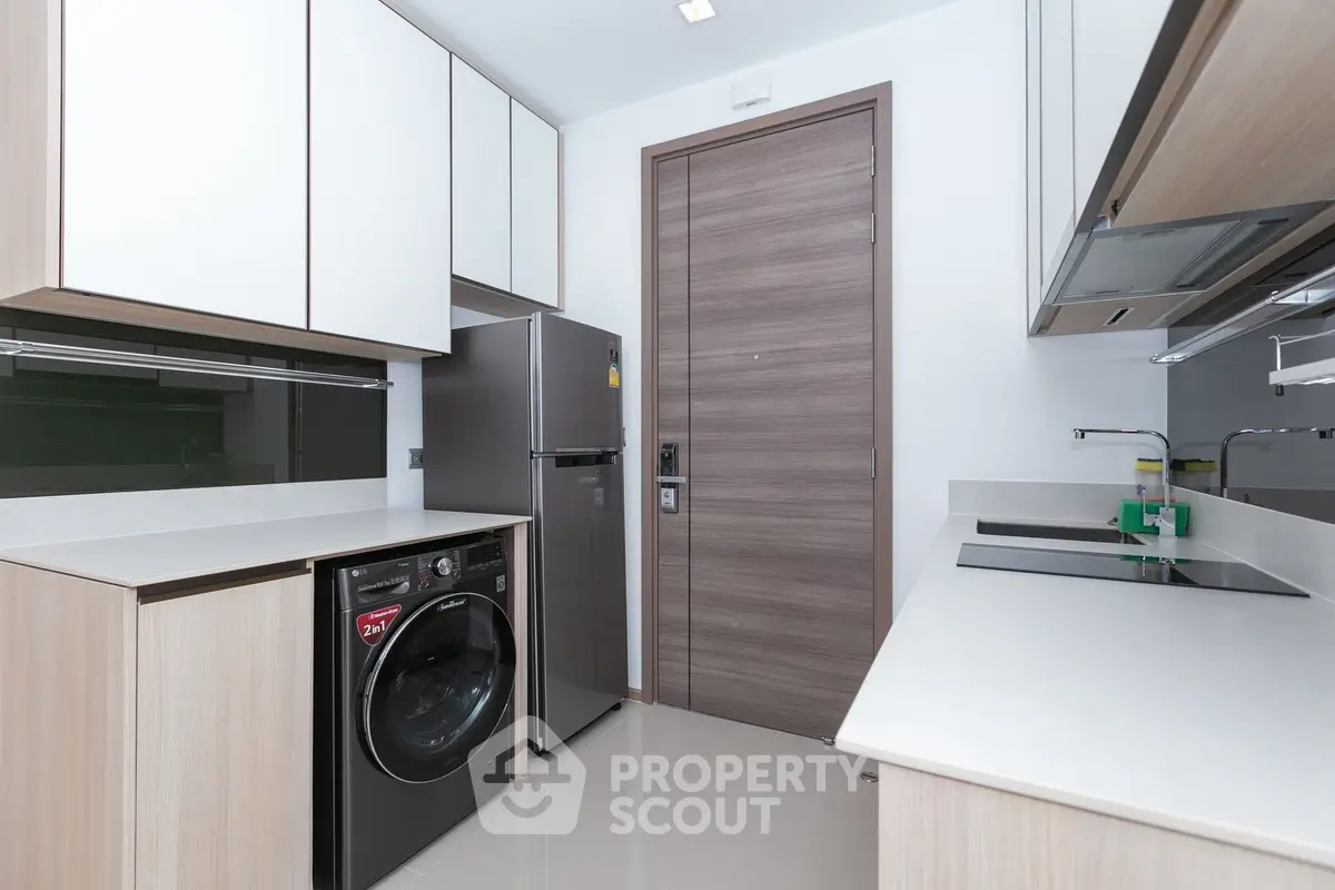 Modern kitchen with sleek appliances and ample storage space