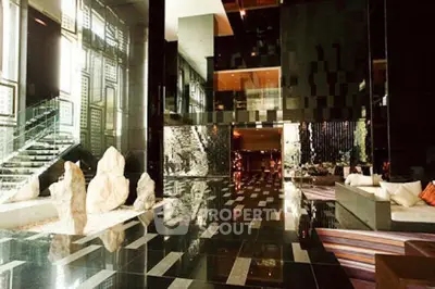 Luxurious modern building lobby with sleek black tiles and elegant decor