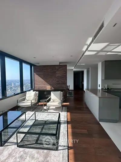 Luxurious modern living room with panoramic city views and sleek interior design.