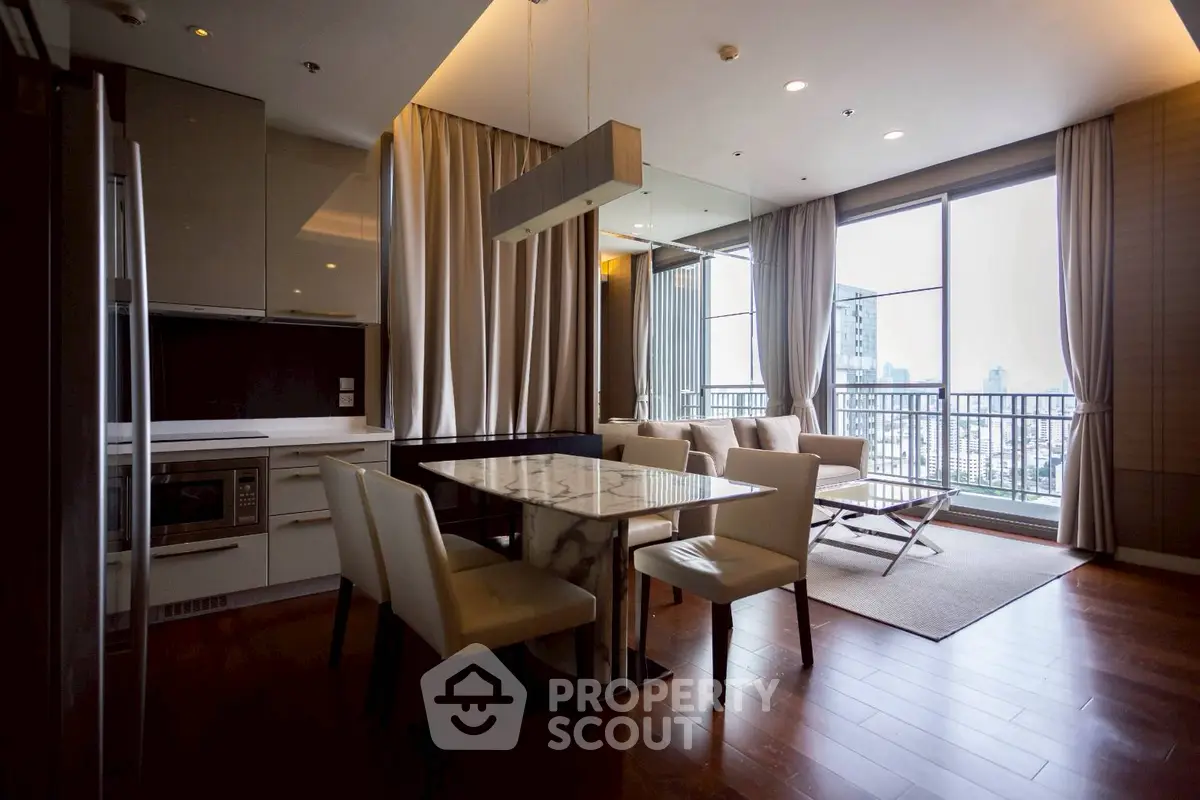 Luxurious open-plan living room with dining area and city view balcony.