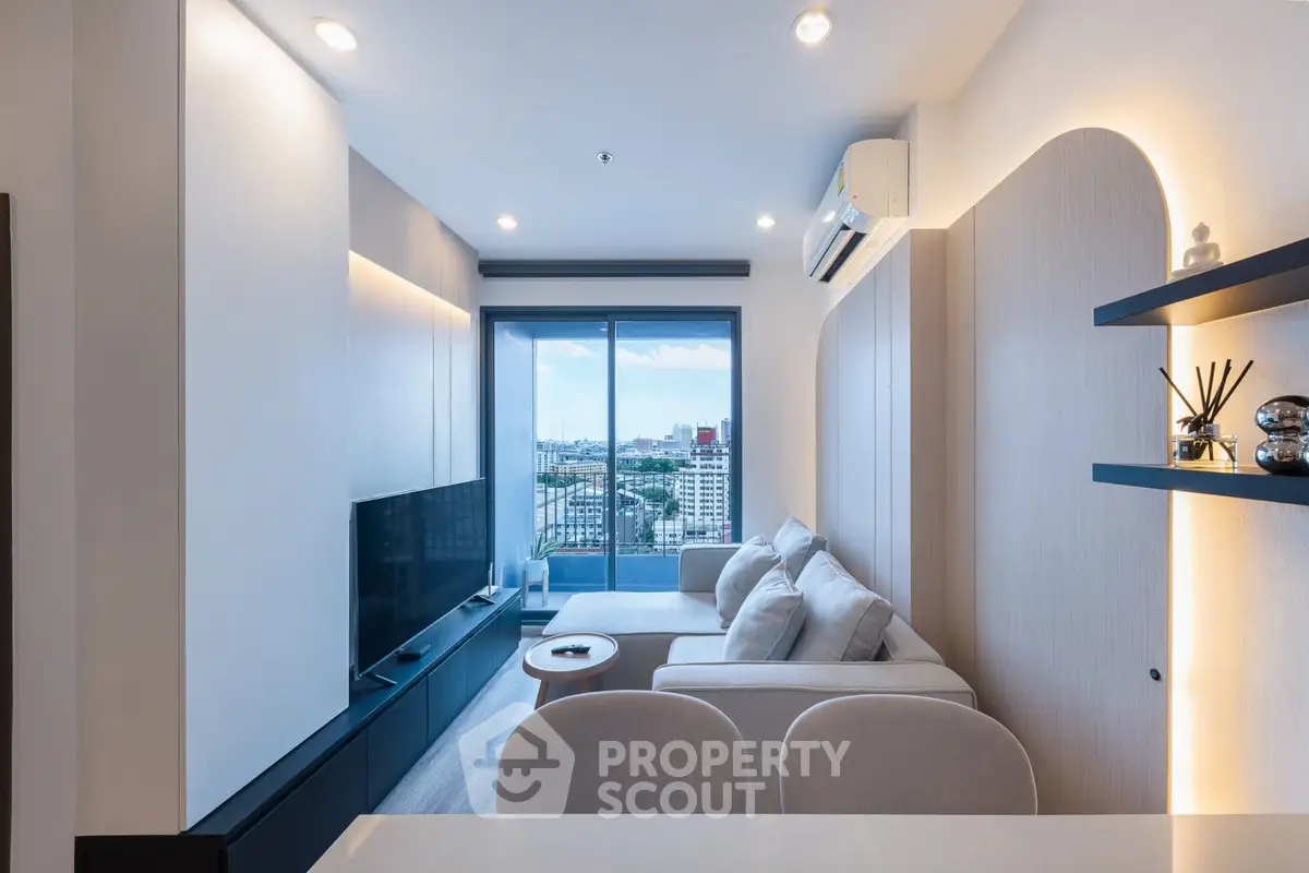 Modern living room with large windows offering stunning city views, sleek furniture, and ambient lighting.