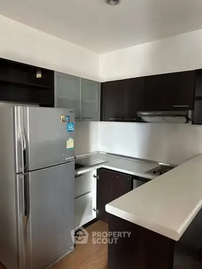 Modern kitchen with sleek cabinets and stainless steel appliances