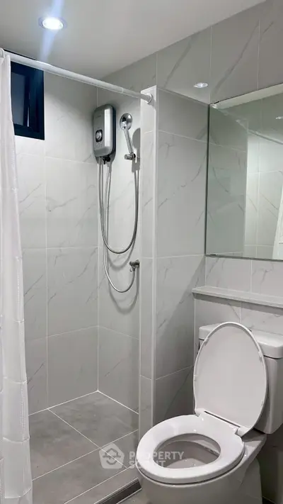 Modern bathroom with sleek shower and contemporary fixtures
