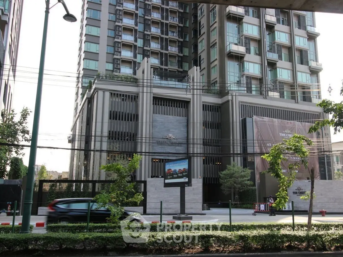 Modern high-rise building with sleek architecture and urban surroundings.