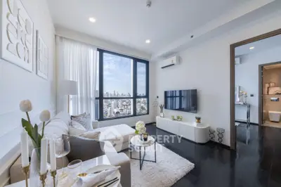 Luxurious modern living room with stunning city view and elegant decor