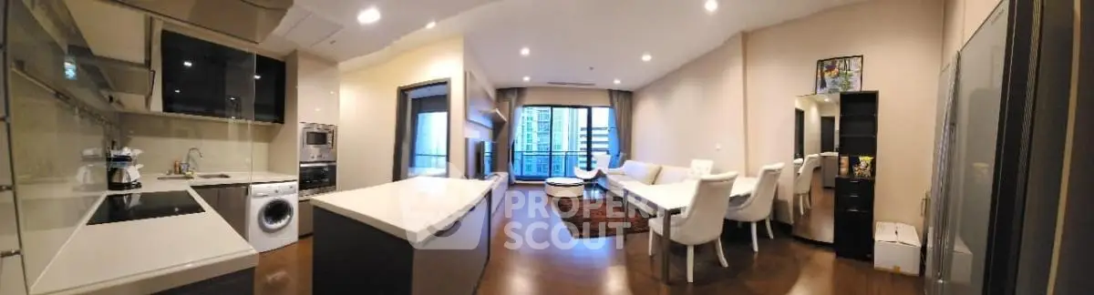 Spacious modern living room with open kitchen and large windows in luxury apartment.