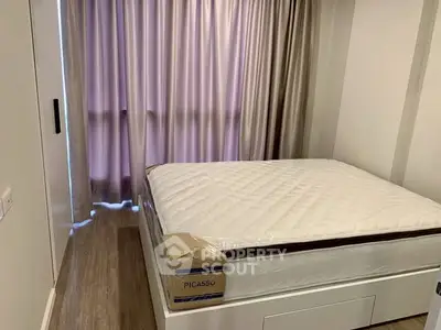 Cozy bedroom with new mattress and floor-to-ceiling curtains