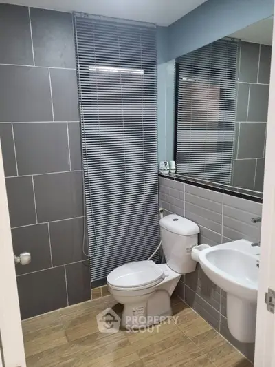 Modern bathroom with sleek gray tiles and stylish fixtures