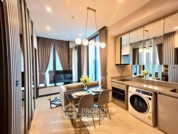Modern open-plan kitchen and living area with stylish decor and appliances
