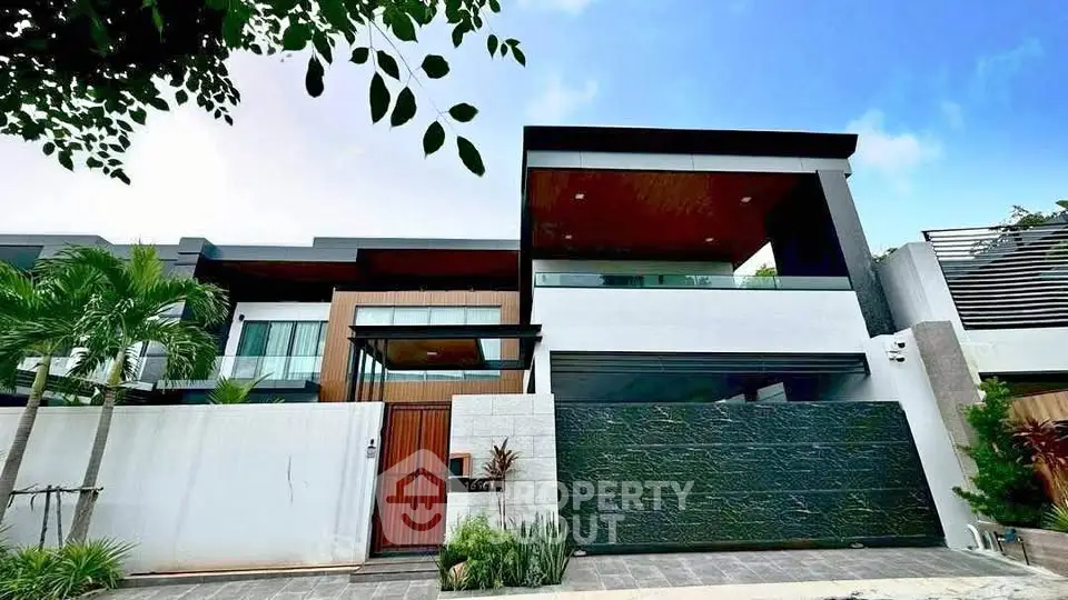 Luxurious modern house exterior with sleek design and lush greenery