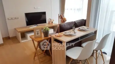 Modern living room with stylish dining area and TV setup