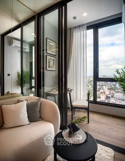 Modern living room with floor-to-ceiling windows offering stunning city views and elegant decor.