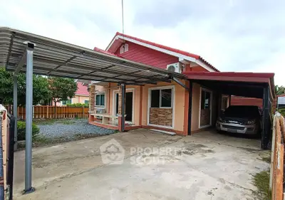 Charming single-story home with carport and spacious driveway in a serene neighborhood.