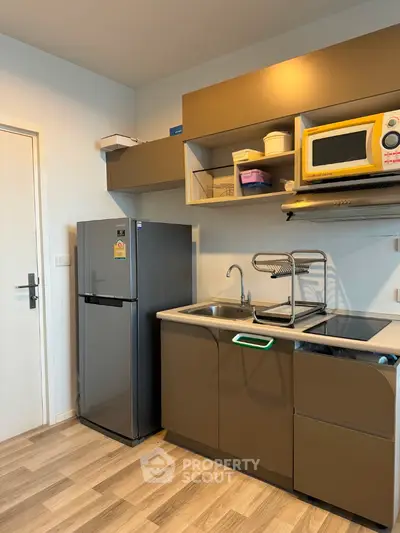 Modern kitchen with sleek cabinetry and stainless steel appliances