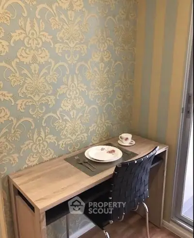 Chic study nook with elegant wallpaper and modern desk setup