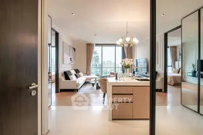 Luxurious open-plan living room with elegant decor and stunning city view.