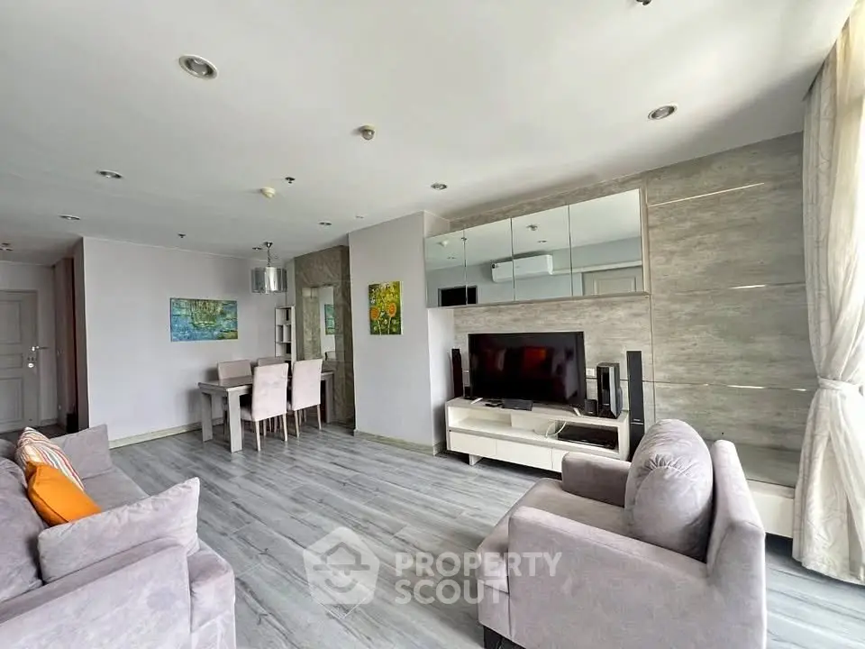 Spacious modern living room with elegant decor and ample natural light