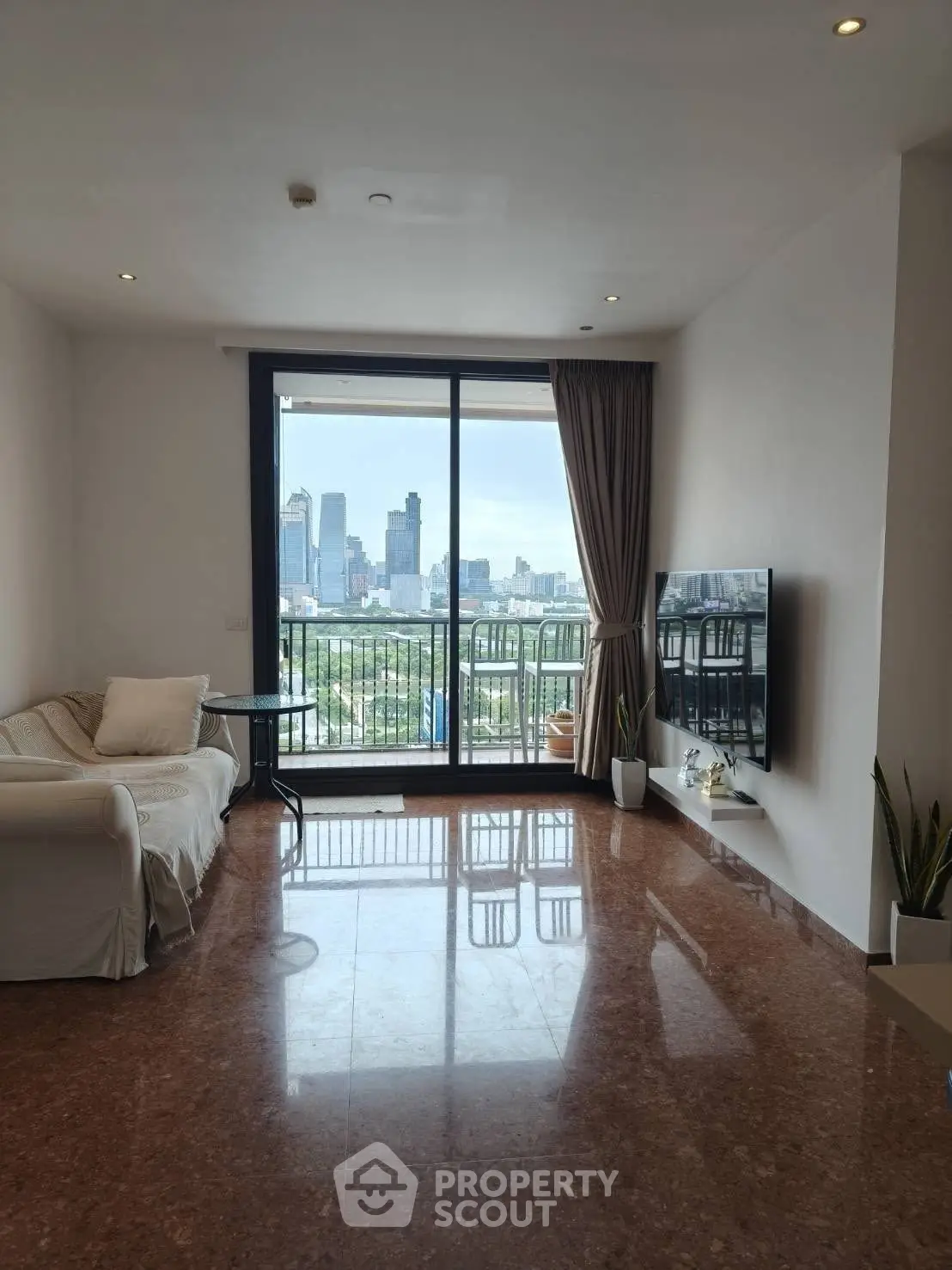 Spacious living room with stunning city view and elegant decor