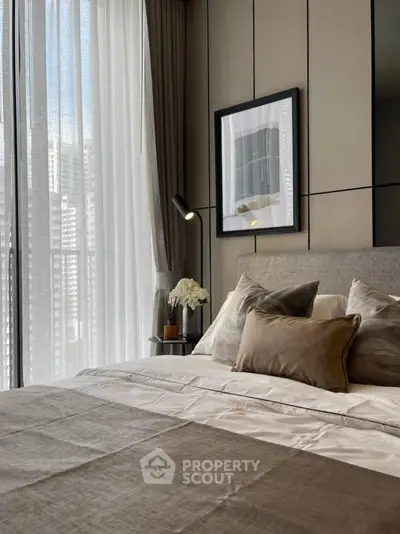 Luxurious bedroom with elegant decor and large window view