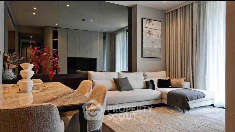 Luxurious modern living room with elegant decor and large sectional sofa, perfect for relaxation and entertainment.