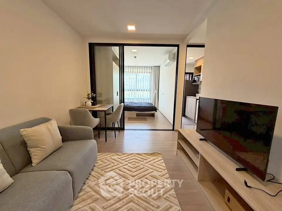 Modern open-plan living room with cozy seating and stylish decor