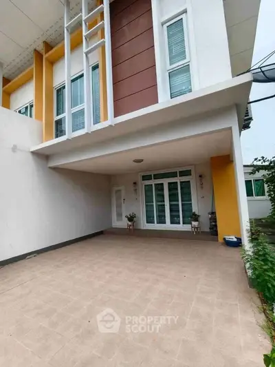 Modern two-story house with spacious driveway and stylish facade