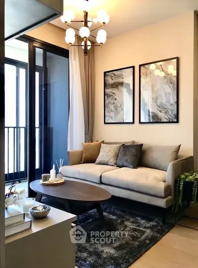 Stylish living room with modern decor and cozy seating area, perfect for relaxation.