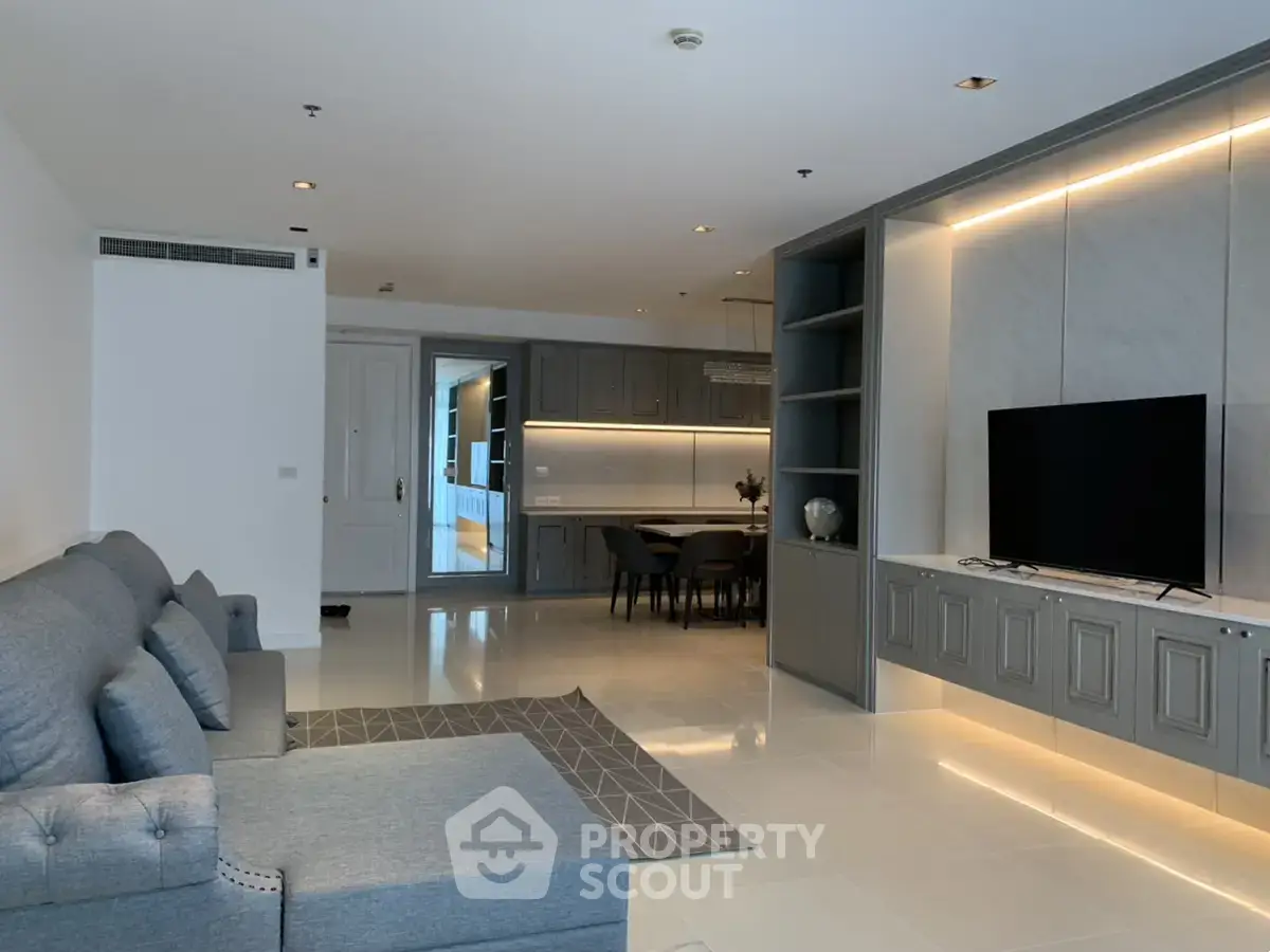 Spacious modern living room with sleek design and open kitchen layout